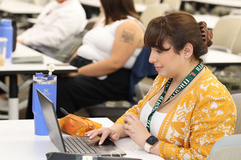 Person on the computer in class