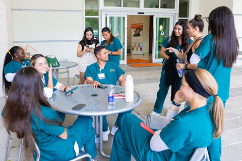 Nursing students gathering outdoors