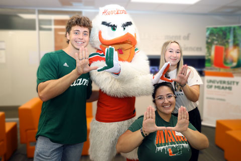 Students with Sebastian doing the U sign